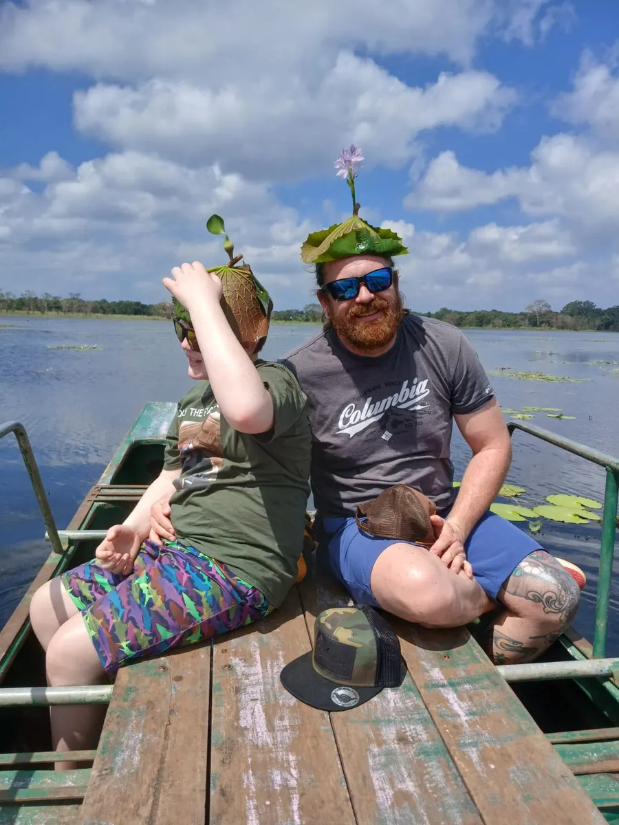 Lotus-leaf hats on the lake, Sri Lanka